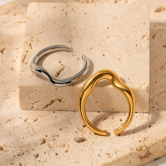 Gold and Silver Rings on stone surface