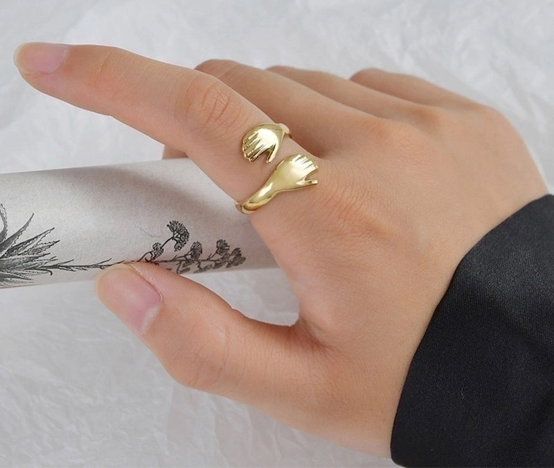 Ring on index finger, with hand holding object