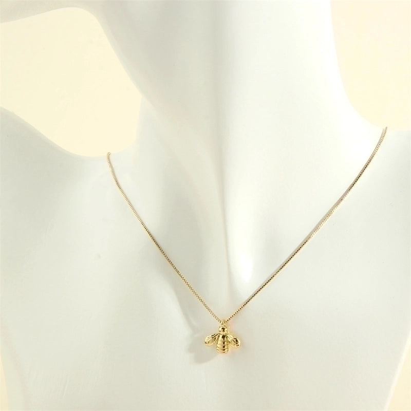 Gold necklace being worn 