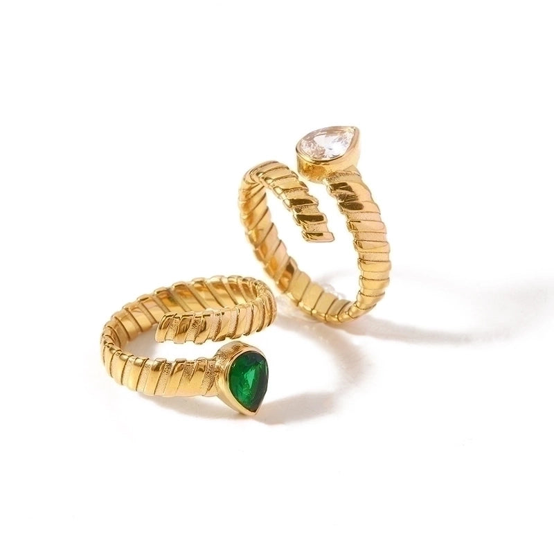 Green and Clear stone rings on white background