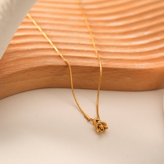 Necklace resting on table