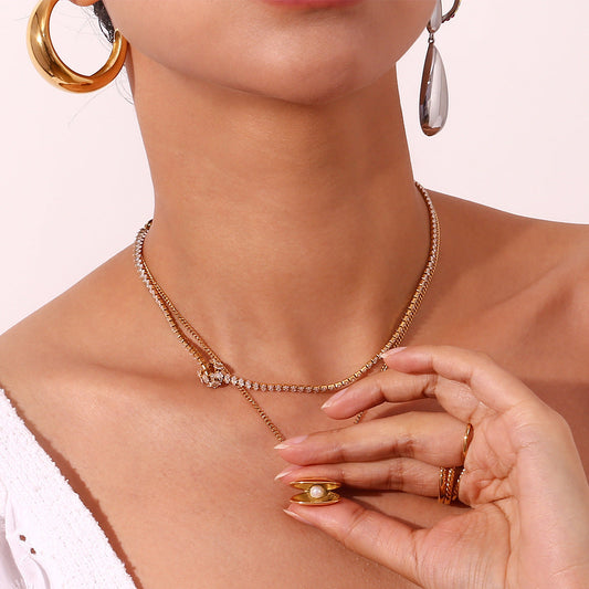 Necklace being worn and open, with the Oyster pendant being held