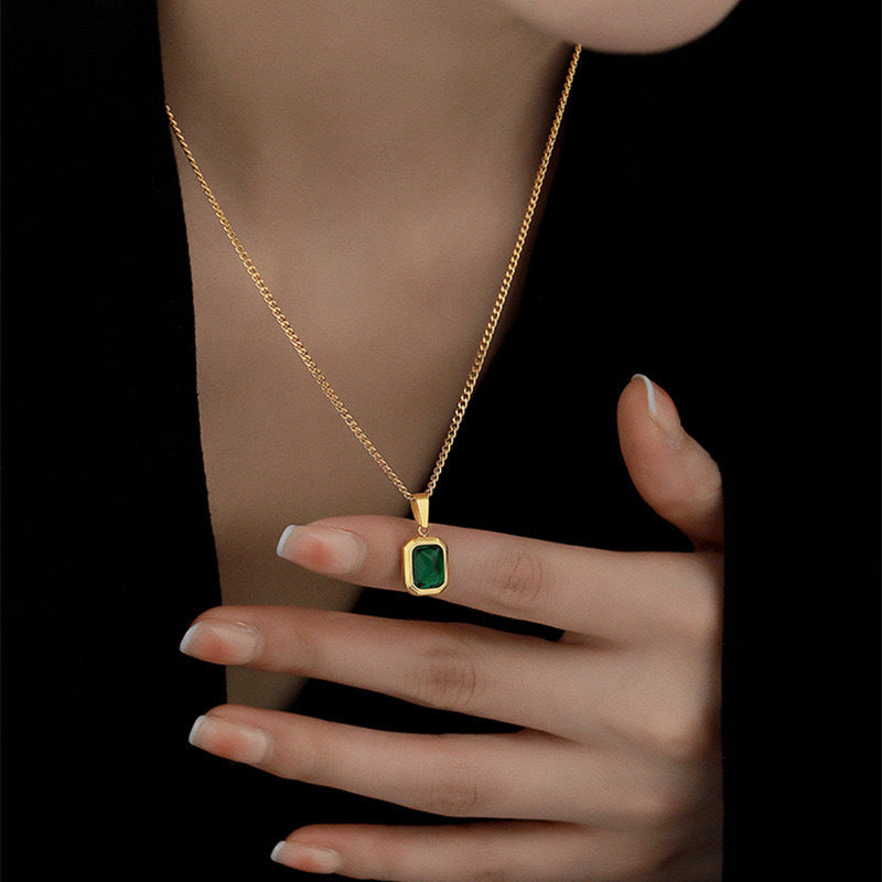 Necklace being worn and pendant raised with wearer’s finger