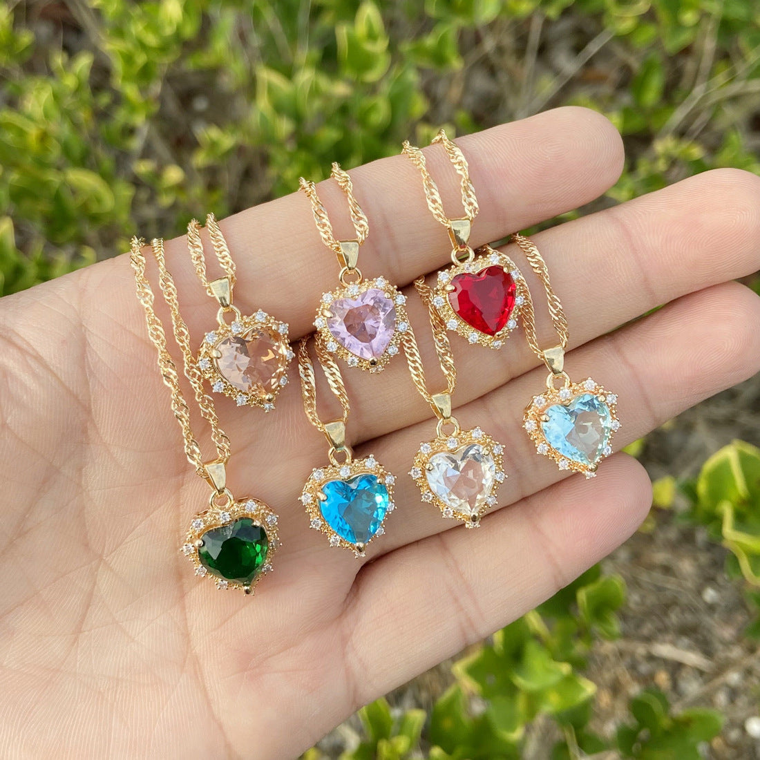 All necklaces being held in someone’s open palm
