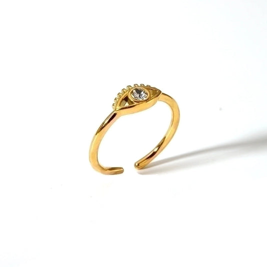 Vintage style gold open ring with evil eye design, and silver rhinestone in the middle, displayed alone on white background